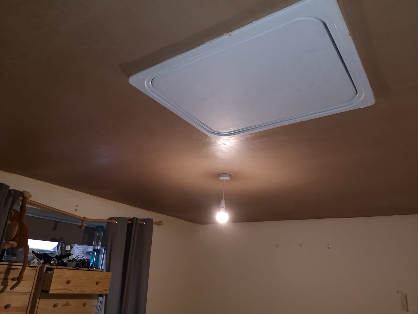 Freshly skimmed ceiling with a loft hatch